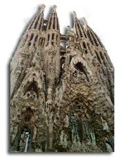 Anton Gaudi - The completed 
              east transept of the Sagrada Familia with its four towers and three portals.